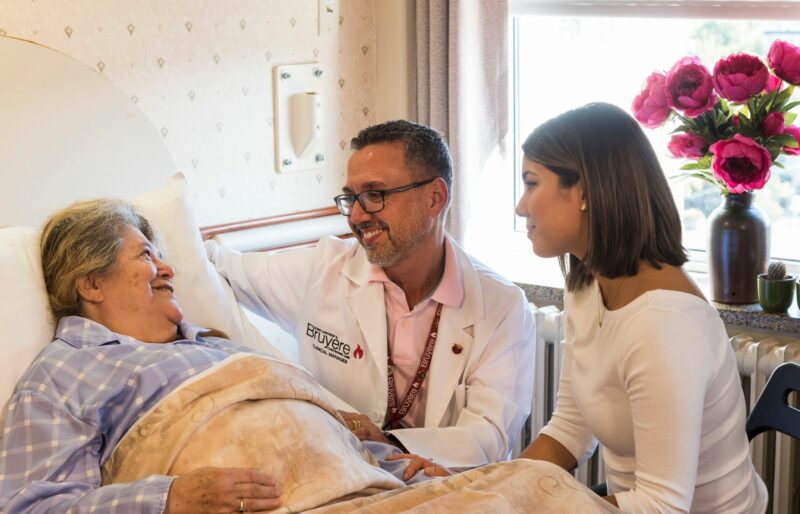 Bruyère Palliative Care Unit patient with staff and family member