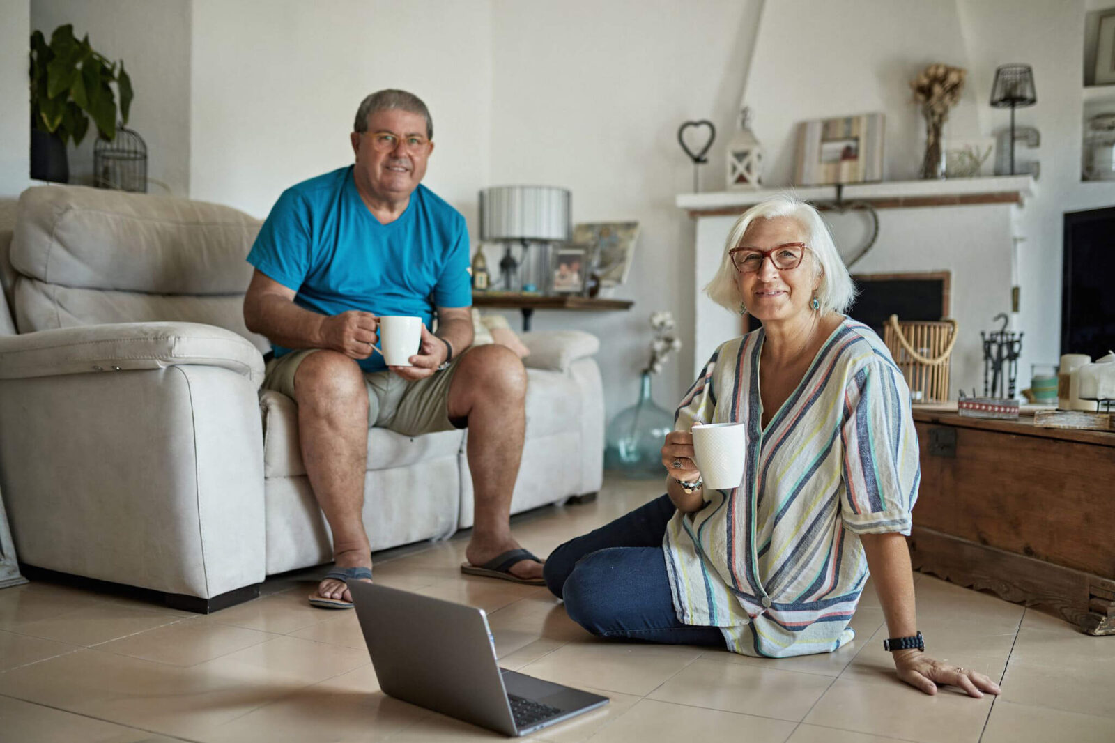 A senior couple relaxing in their living room